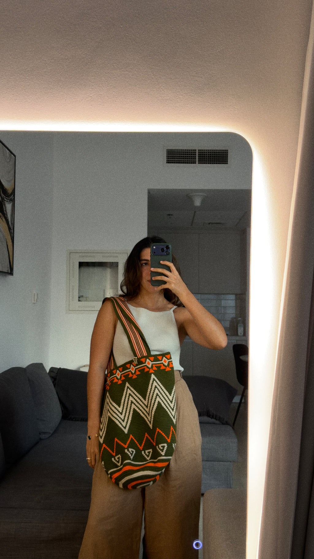 PALANACHI de la Tierra Wayuu Tote Bag in green and orange by iiwa kashi, handcrafted by Wayuu artisans from La Guajira, Venezuela, made with pure cotton and 24K gold-plated silver logo.